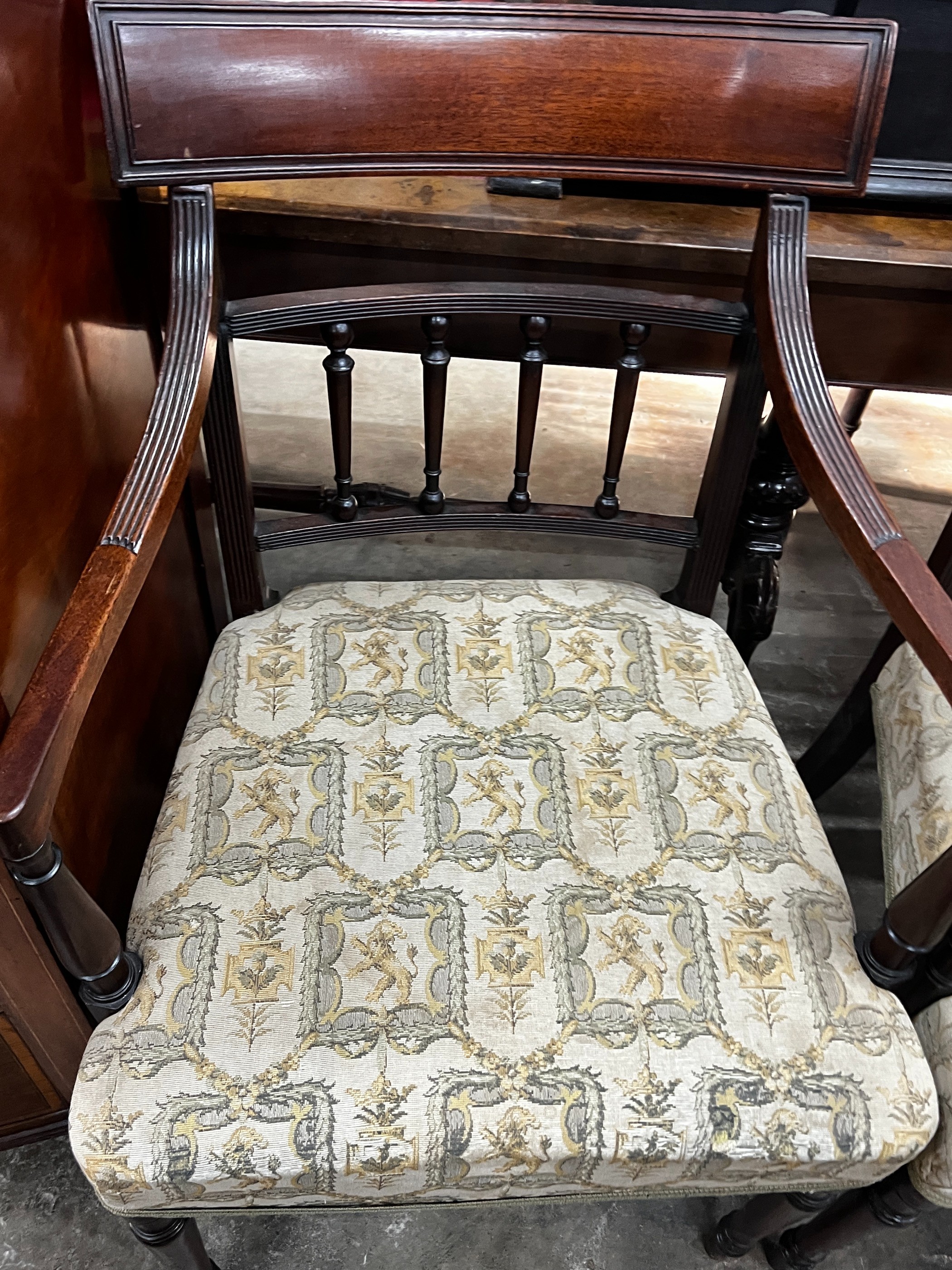 A pair of George III mahogany elbow chairs, width 52cm, height 88cm